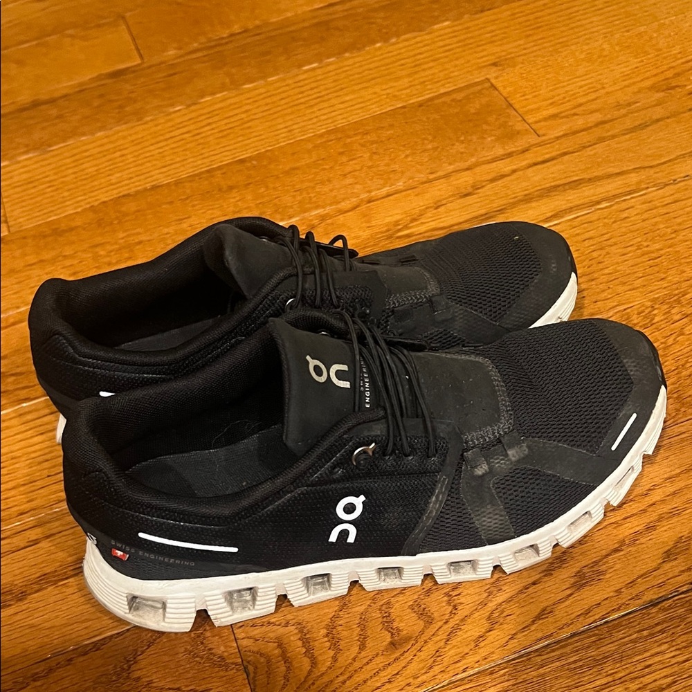 On Running Woman’s Black Athletic Shoes with White Soles